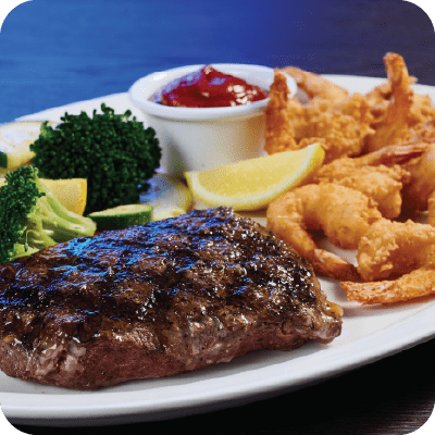flat iron steak with fried shrimp on the side