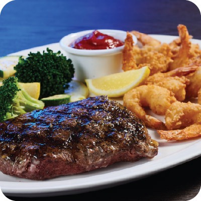 flat iron steak with fried shrimp on the side